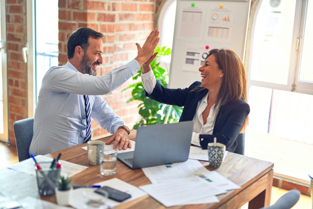 Image of adults high fiving